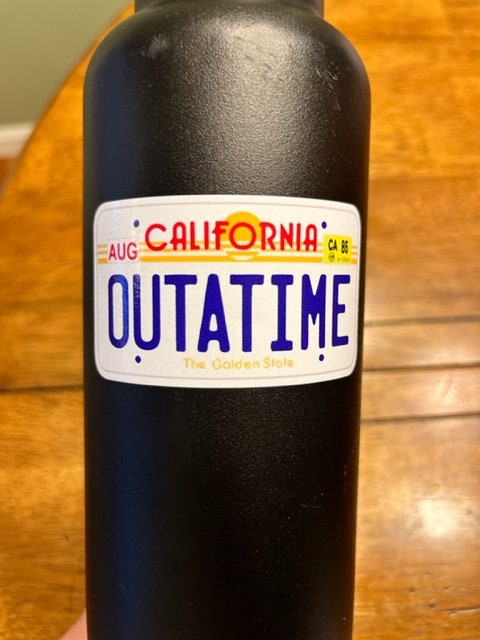 Fun Vinyl Sticker - Outatime. Back To The Future.  Waterproof. Sticker Decal for Water Bottles, Laptop, Car Window.